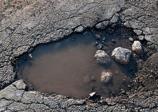 A photo of a pothole.